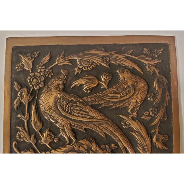 Hand Made Copper Plaque with animals and plants surrounding the animals. The plaque has a black background from all the...