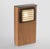 Post light in wood with ‘Steplight’ in dark bronze. With removable back panel for anchoring and electrical connection. For...
