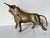 Available for sale this fantastic vintage brass sculpture of a charging bull, exuding strength and movement. The finely...