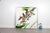 A dynamic contemporary mixed-media painting depicting a female tennis player in motion, poised with racket extended during...