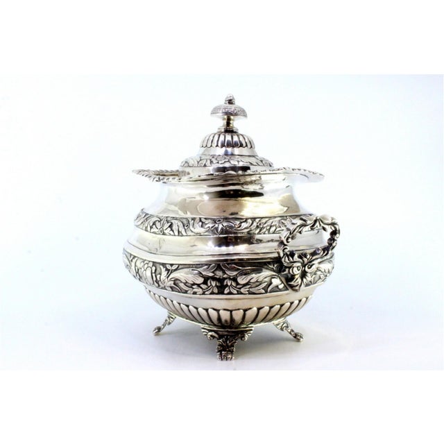 Silver Sugar Bowl with Reliefs, Applications, Handles, Knob Lid and Claw-Shaped Feet, in Very Good conditions. Designed...