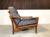 This Danish easy chair in teak was manufactured by Glostrup in the 1960s. The high-quality chair is comfortably...