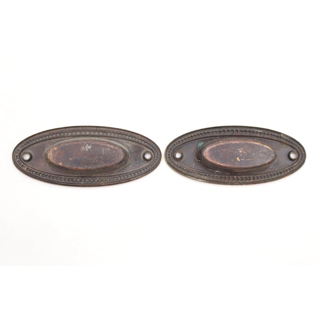 Traditional style brass oval recessed window sash lifts. The original mounting screws are not available. Good condition...