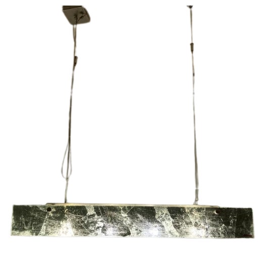 Height-adjustable suspension lamp with steel cable and offset light point, from which hangs a rectangular matt chromed...