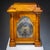 A "marriage" combining a Baroque bronze wall clock with a Biedermeier case in the form of a temple. The case, crafted from...