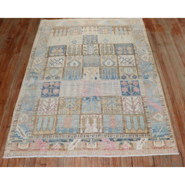 A circa 1940 fun Persian Bakhtiari square intermediate-size rug with a garden box design Measures: 6'x 8'4".