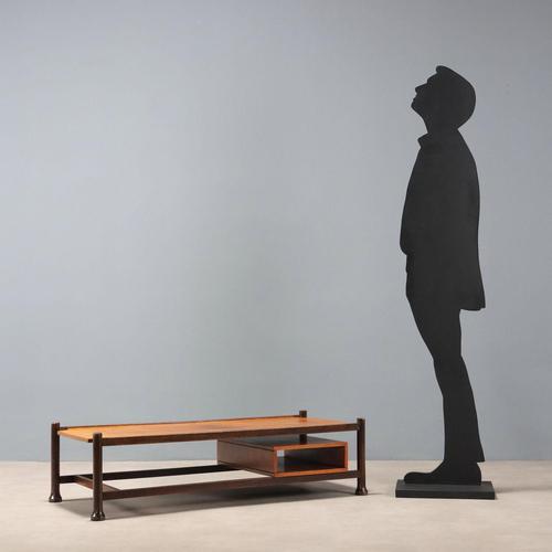 Coffee table with open compartment under the top, solid walnut-stained wood and exotic wood veneer top. This piece is...