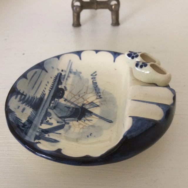 Blue and white Delft windmill scene ashtray. Comes with a brass stand to display.