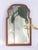 Antique wooden wall mirror with a scalloped frame and beveled mirror. The beautiful mirror features an oak frame and...
