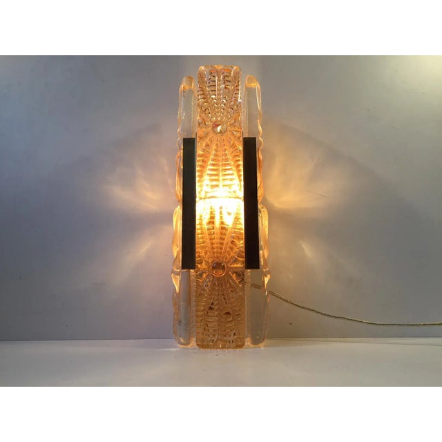 This large model Aladdin sconce (Design No. 15008) is made of brass and features thick textured amber glass panels....