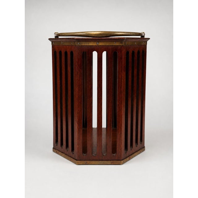 An impressive English Georgian plate bucket, finely constructed in rich mahogany with brass mounts, brass strapping and an...
