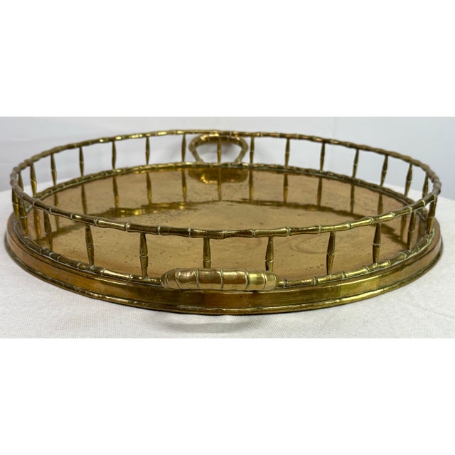 Large vintage round d brass tray with brass faux bamboo handles and rails. Tray is over 20 inches and would be perfect for...