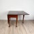 A Georgian pad foot dropleaf table, England circa 1780. Width measures 57.25" when open, 20.5" when closed.