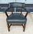 This vintage office chair by Statesville Ross features deep blue leather upholstery, a gently curved open back, padded...