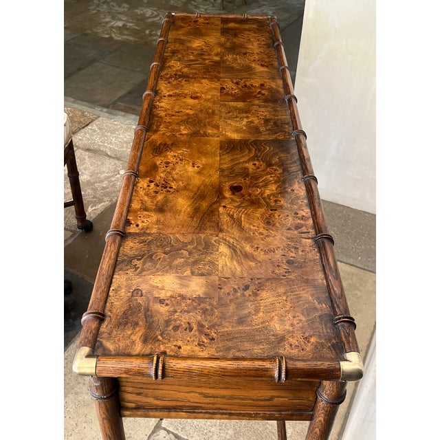 Vintage Hekman Furniture console table with a burl wood top, faux bamboo look and brass hardware. The space from the...