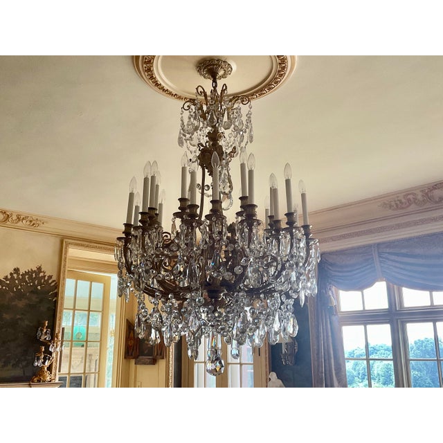 Purchased this 24-light chandelier at the renowned French Antique Shop in New Orleans. Check out their website -...
