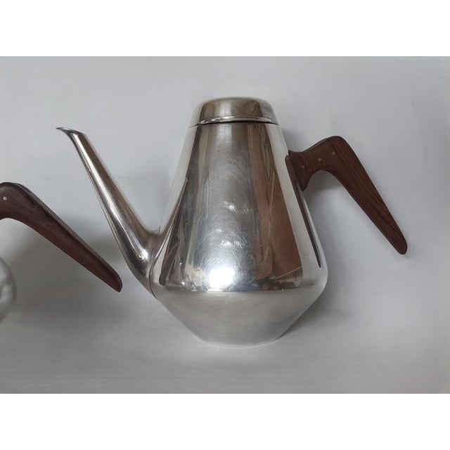 A vintage Mid Century Modern, Scandinavian Design Tea Set. The set includes a coffee pot, teapot, sugar and creamer. They...