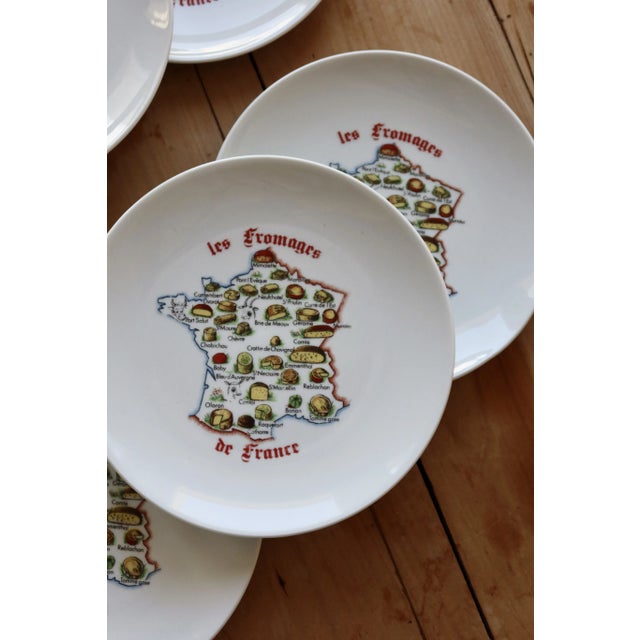 Lovely vintage set of porcelain cheese plates. They feature a delicate polychrome pattern of France and its cheese...