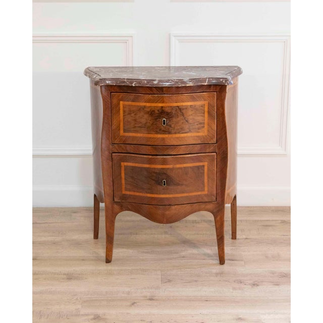Elegant small Italian chest of drawers crafted in walnut and walnut veneer during the Louis XV period, second half of the...