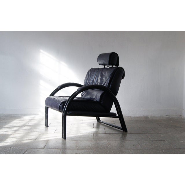 Timeless Italian Design. This leather armchair is a fantastic piece that effortlessly draws the eye. The metal tubular...