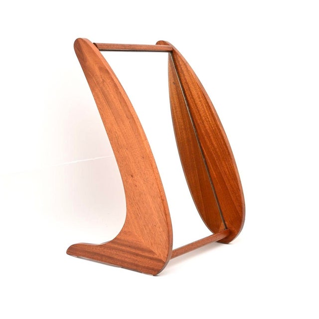 A wonderful vintage teak table top vanity mirror, made in England and dating from around the 1950-60’s. It is beautifully...
