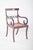 Mahogany chair with straw seat. with curved legs, a slightly arched rear and a saber-shaped front, the arms, also curved,...