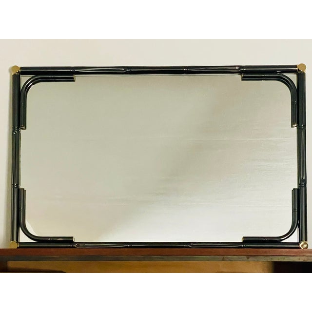 Vintage, rectangular wall mirror made of tubular metal and brass, with a "faux bamboo" design effect, circa 1970's - 80's....