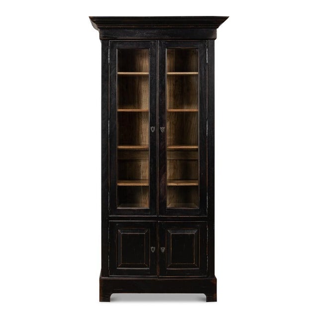 An 80-inch ebonized case and projecting crown bring architectural weight to a library or study wall. The upper section has...