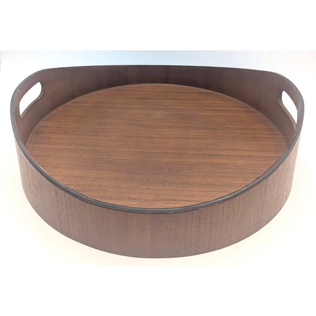 Offered is a mid 20th Century round pressed Teak wood tray made in Japan some time between the mid 1950s to mid 1960s. It...
