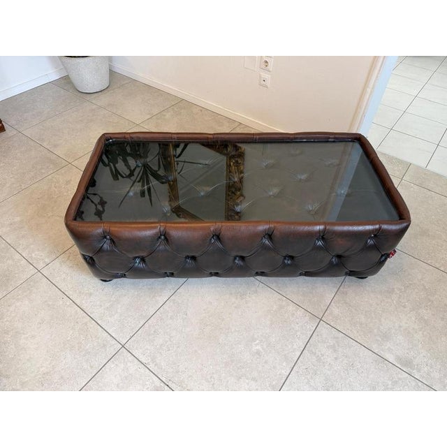 For sale is an exclusive Chesterfield coffee table in antique brown. This exquisite, iconic Chesterfield living room table...