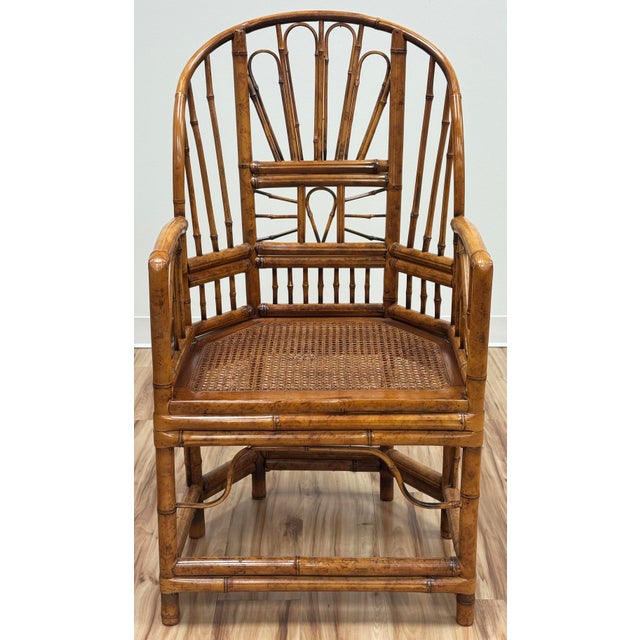 Vintage bamboo Brighton Pavilion style armchair featuring classic burnt tortoise finish with high back and caned seat....