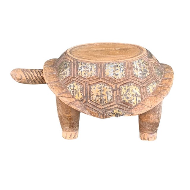 This vintage African wooden turtle is a charming piece of folk art, showcasing the craftsmanship of African artisans....