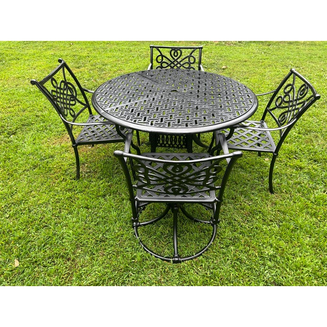 Perfect for your outdoor space! There is one chair that has a slightly different design. The table measures 48x28 and the...