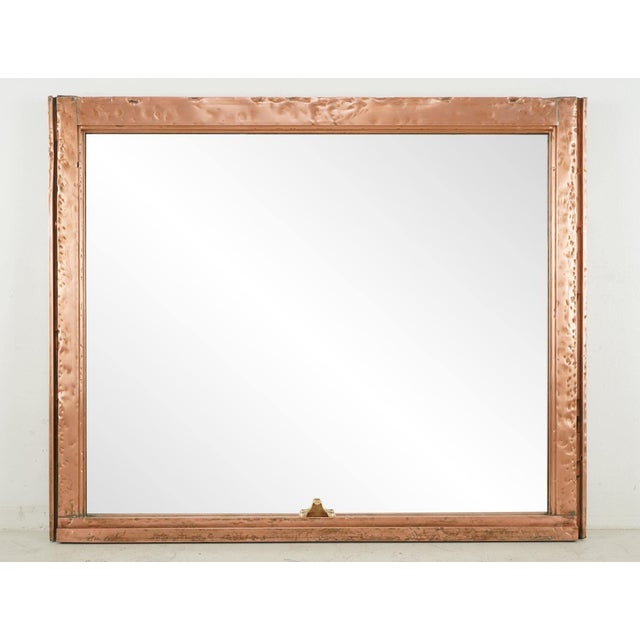 Unique mirror made from a salvaged copper window frame. The copper has been polished to a slight shine. This window came...
