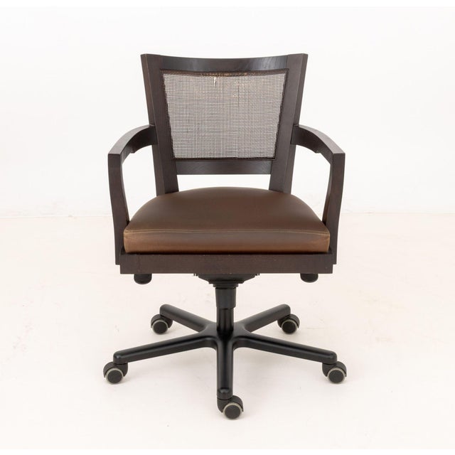 Promemoria Caffe Ufficio Executive Chair, leather upholstered seat, caned back. 35" H x 25" W x 25" D; seat: 21" H....