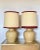 Pair of 70s ceramic table lamps, the fabric of the lampshades has stains, therefore it is to be redone, the measurement of...