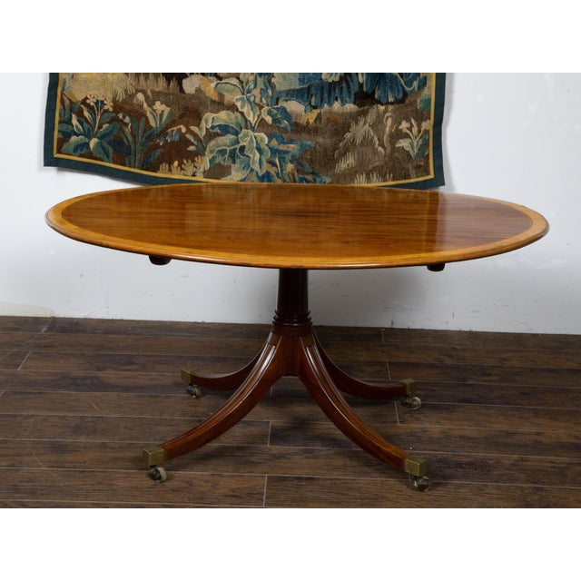 English Mahogany 1840s Oval Top Pedestal Table with Quadripod Base and Casters For Sale In Atlanta - Image 6 of 12