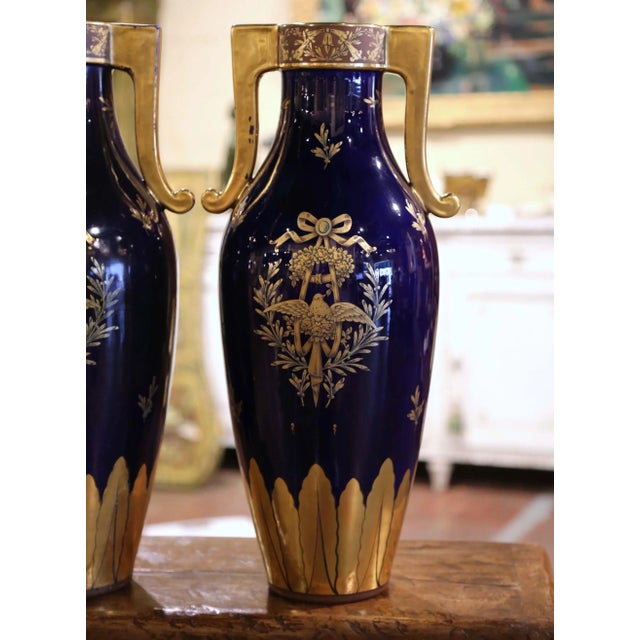 Decorate a console or a buffet with this elegant pair of antique urns from Paris. Crafted circa 1890 and signed on the...