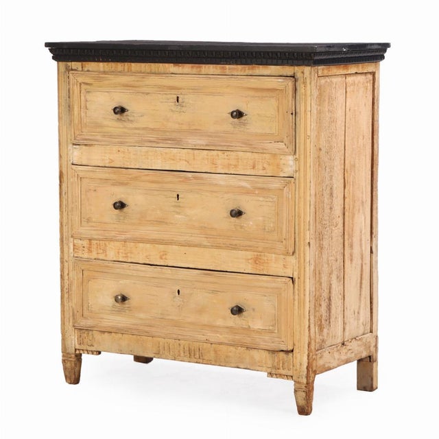 This 19th-century French chest of drawers combines rustic simplicity with elegant presence. Crafted from pine and painted...