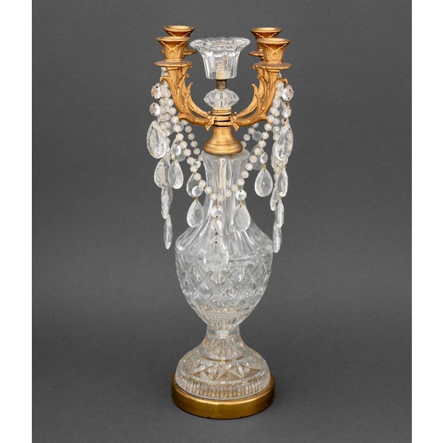 Louis XV Style Gilt Metal and Cut Crystal Candelabrum, with four branches surrounding a central candleholder. 20.75" H x...