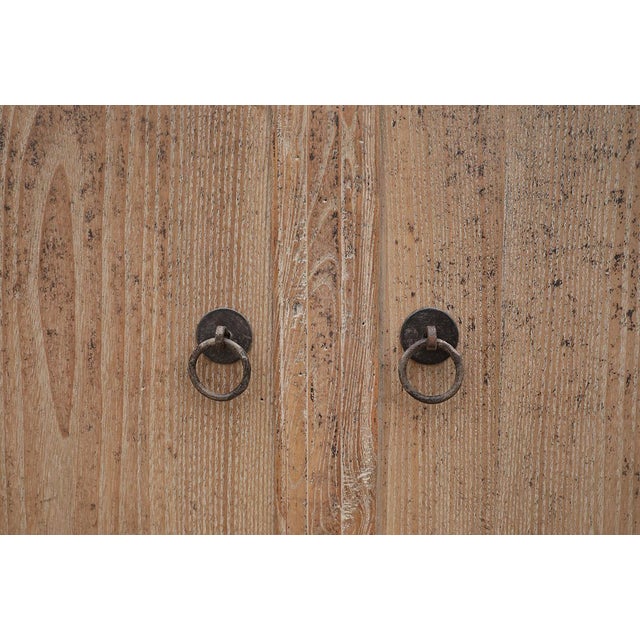 Vintage Chinese Pine Cabinet, in a light natural color, and outstanding patina. A large storage cabinet with 2 center...