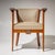 Pair of Italian Art Nouveau armchairs featuring rounded backrests and straight armrests terminating in finely detailed...