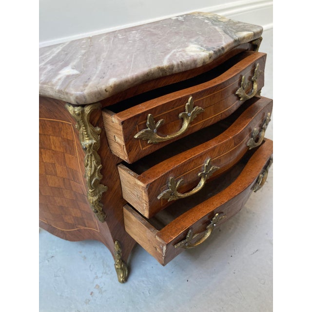 A charming and remarkably detailed 19th-century French miniature commode, or chest of drawers, made in the Louis XV taste...