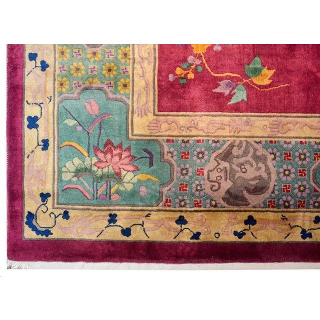 A whimsical early 20th century Chinese Art Deco rug with a peaceful garden landscape depicting a flowering tree branch...