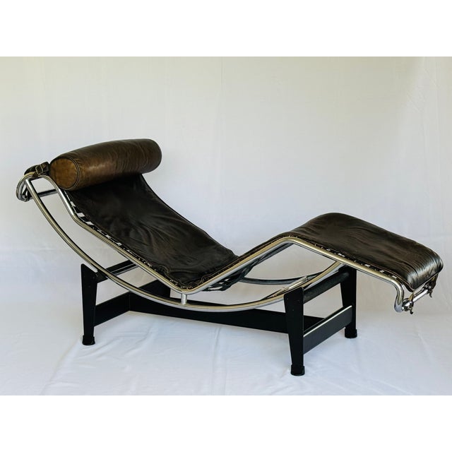 An authentic Model LC4 lounge in leather and chrome. The iconic design by Le Corbusier in collaboration with Pierre...