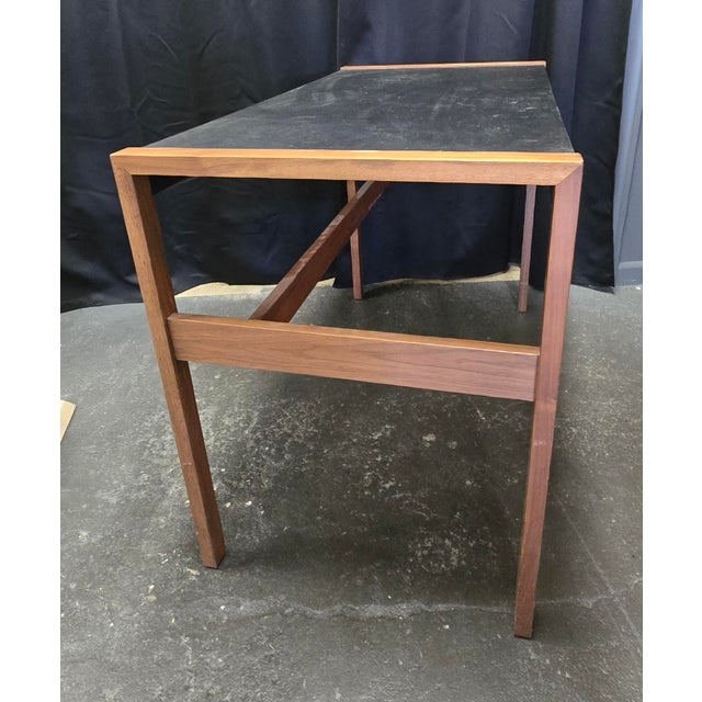 The Design Within Reach Risom Desk is a compact, mid-century modern writing table designed by Jens Risom in 1968....