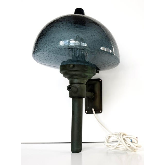 Stunning vintage exterior light from Denmark featuring a hand-blown blue glass dome atop a sculptural copper torch form....