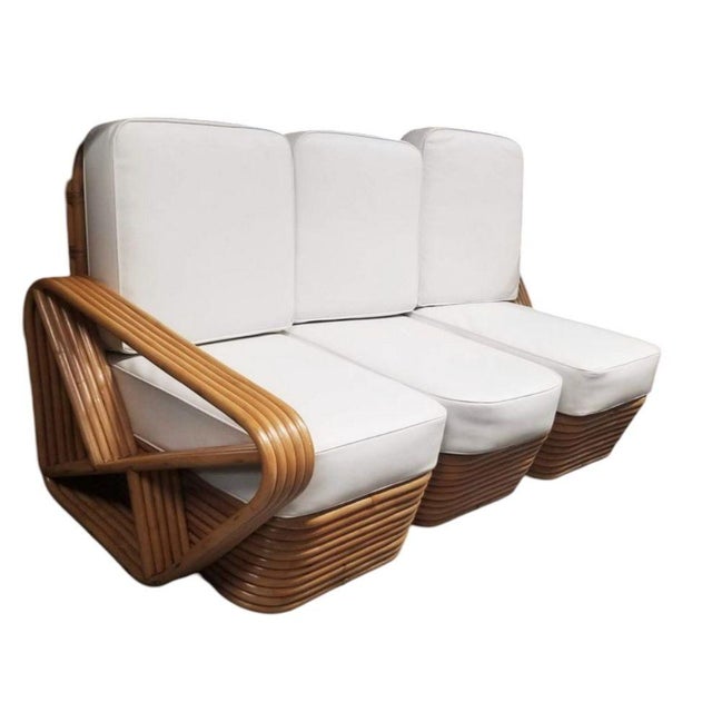 A fully restored living room set featuring a five-strand square pretzel three-seat sectional sofa and matching lounge...