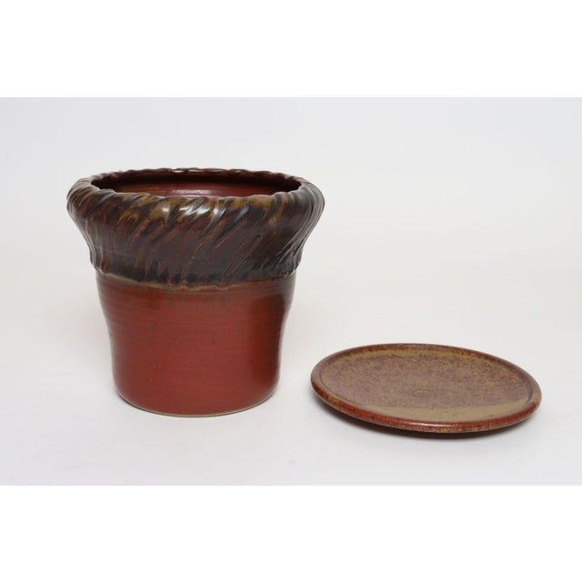 Studio ceramic planter with drainage hole and plate/saucer by ceramicist, Deanna Nichols (b. 1942-2017, Missouri). Holding...