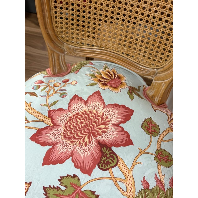 Pair of vintage (1980s-90s) rococo light finish Italian made chairs with cane backs. Have a warmer yellowish tone than...